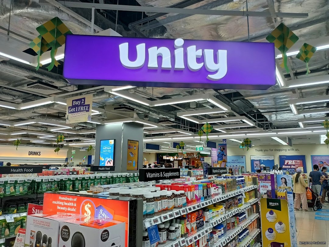 The image shows the interior of a Unity store with shelves of products.