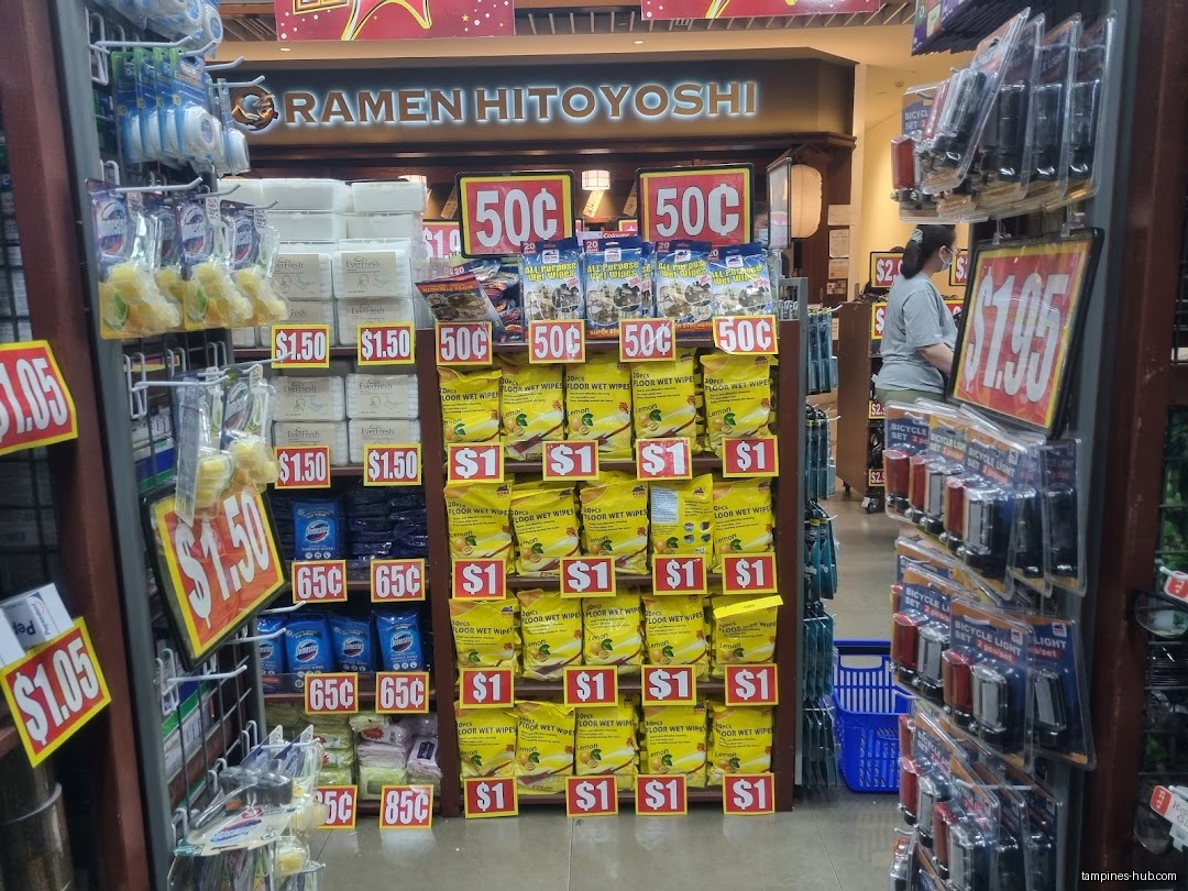 Shelves in a Valu$ store are stocked with various household items and cleaning supplies.