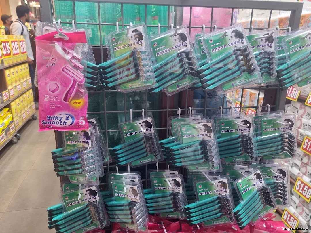 A display of razors for men and women in a retail store.