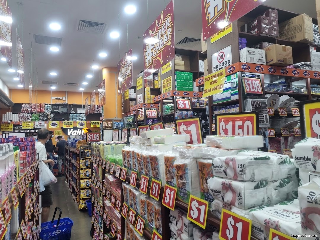 Interior view of Valu$ shop with shelves stocked with various products.