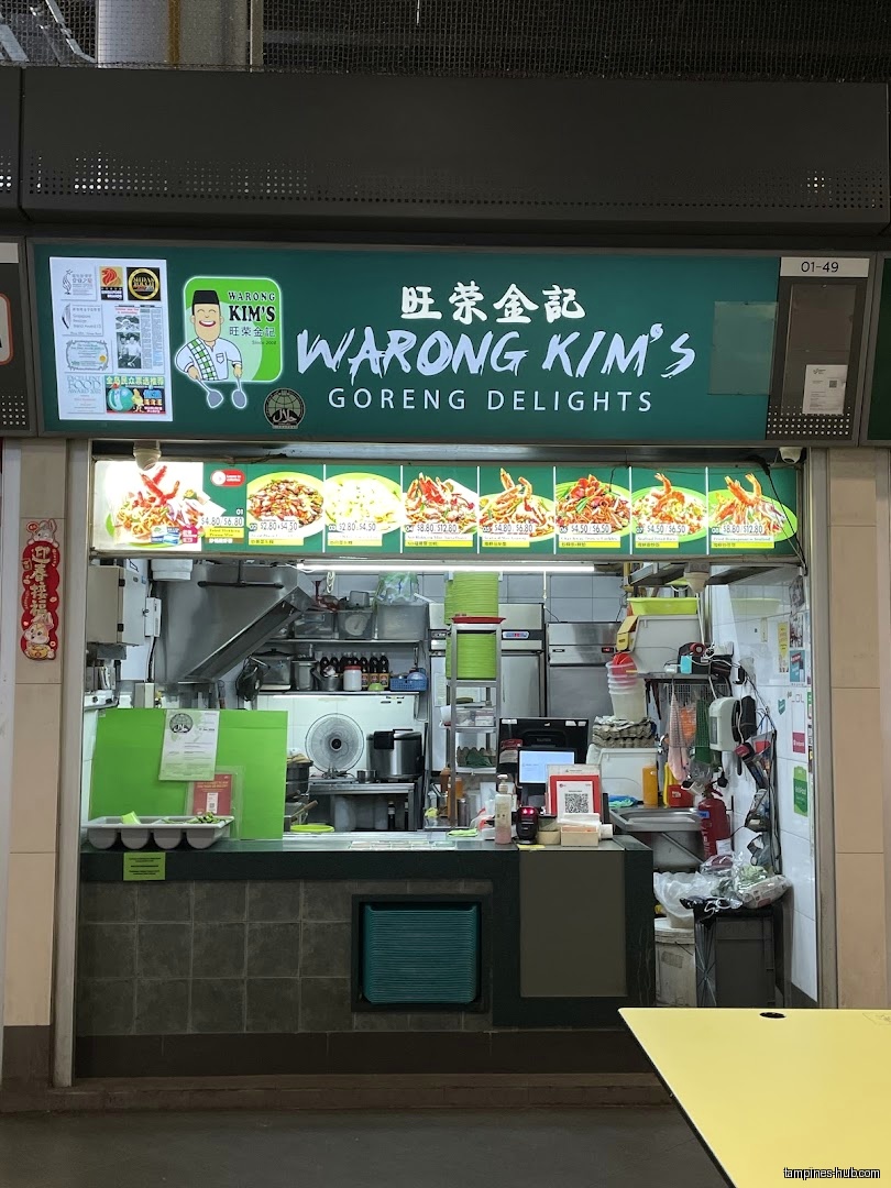 Warong Kim's Goreng Delights shop front with menu pictures above counter.