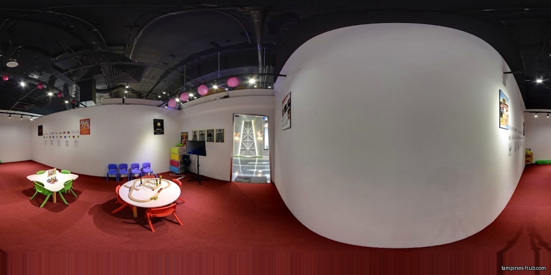 Interior of We Love SGP shop with tables, chairs, and wall decorations.