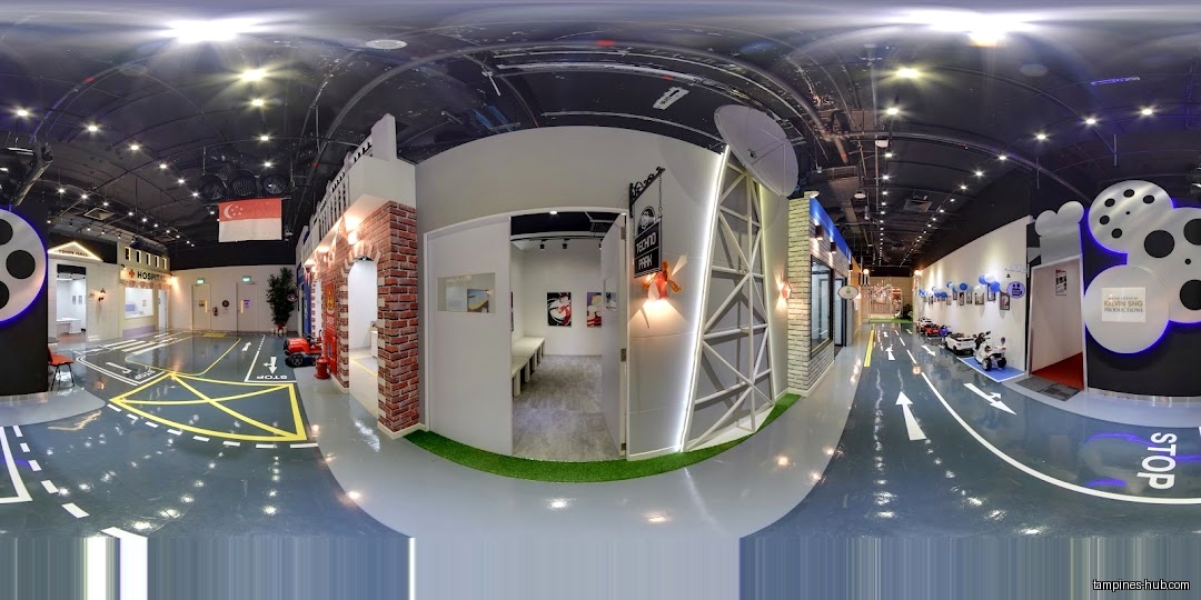 Interior view of We Love SGP, showing themed play areas and road markings.