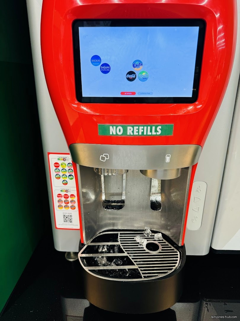 A self-serve soda fountain machine with a digital display and ice.