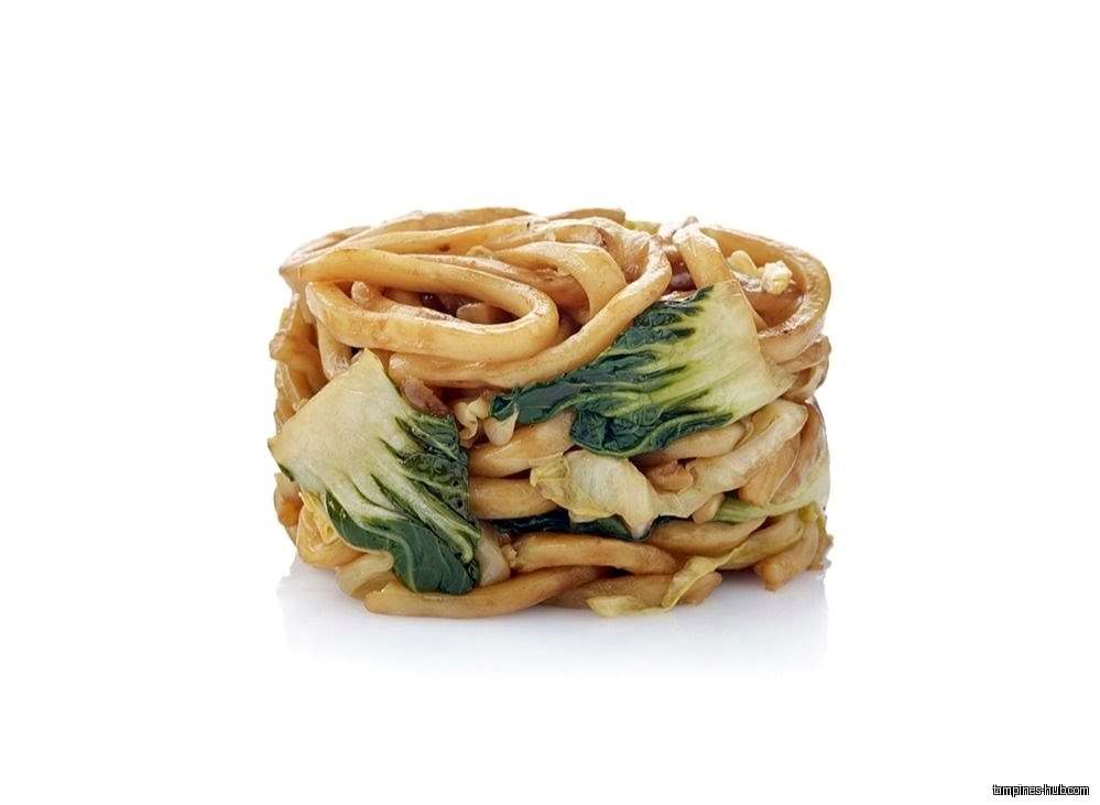 A stack of stir-fried noodles with bok choy on a white background.