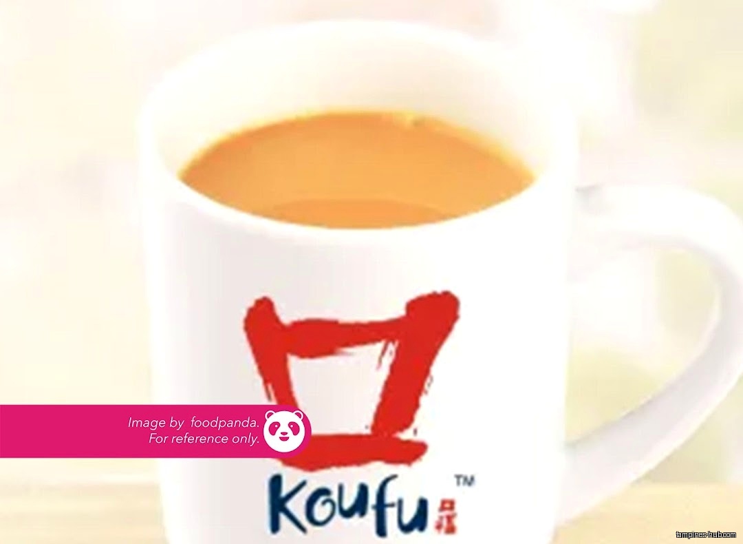 A white mug with a red logo filled with a beverage.