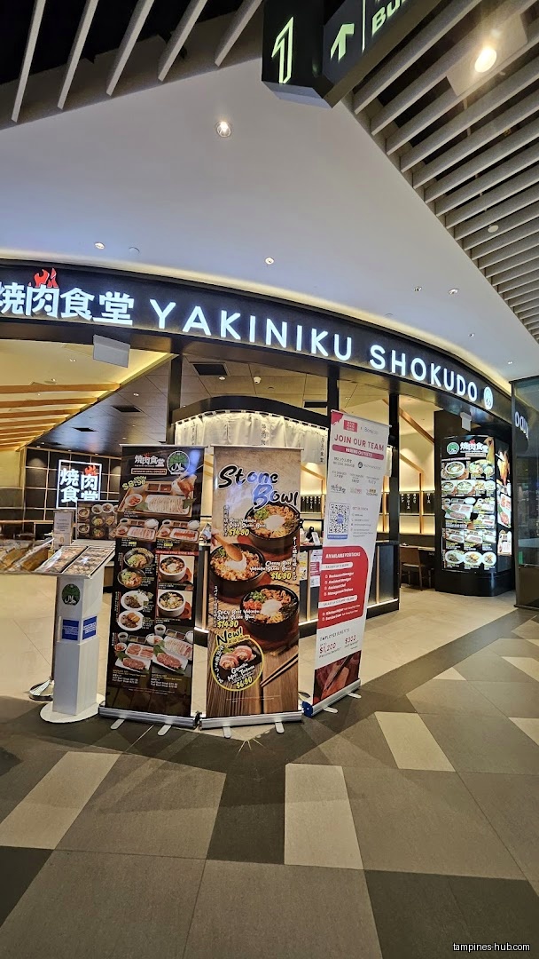 The image shows the storefront of Yakiniku Shokudo with menu displays.