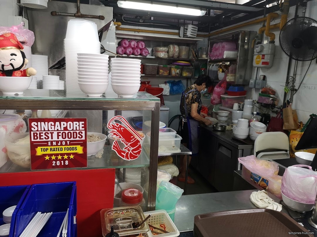 Interior view of Yong Seng Heng Prawn Noodle shop with a worker.